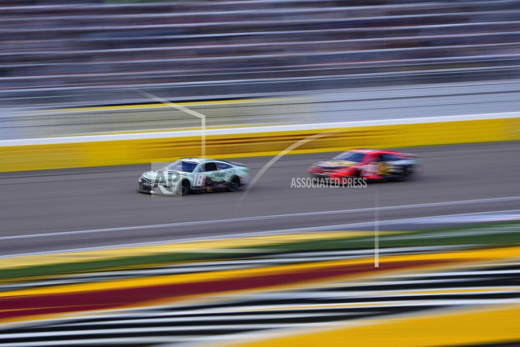 John Locher Kyle Busch (18) and Martin Truex Jr. (19) race during a NASCAR Cup Series auto race Sunday, March 6, 2022, in Las Vegas. (AP Photo/John Locher)