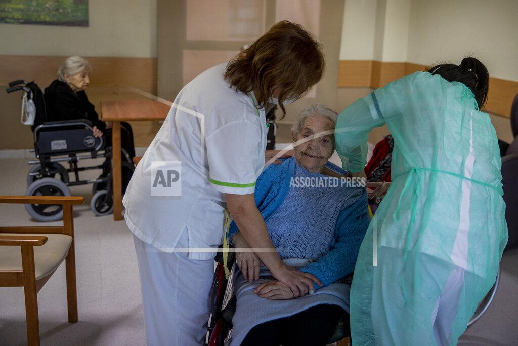 Manu Fernandez A nurse administers the Pfizer-BioNTech COVID-19 vaccine to a resident at DomusVi nursing home in Leganes, Spain, Wednesday, Jan. 13, 2021. Spain's rate of infection has shot up to 435 cases per 100,000 residents in the past two weeks, prompting new restrictions as authorities try to bring vaccination up to speed. (AP Photo/Manu Fernandez)