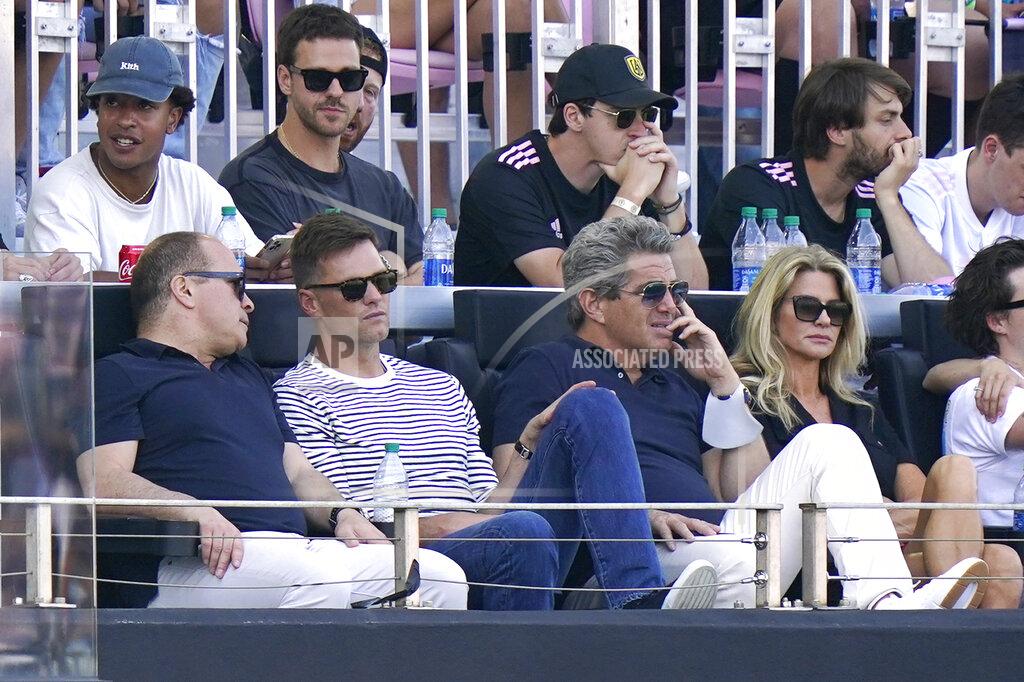 Lynne Sladky Tampa Bay Buccaneers quarterback Tom Brady, second from front left, watches the second half of an MLS soccer match between Inter Miami and the LA Galaxy, Sunday, April 18, 2021, in Fort Lauderdale, Fla. (AP Photo/Lynne Sladky)