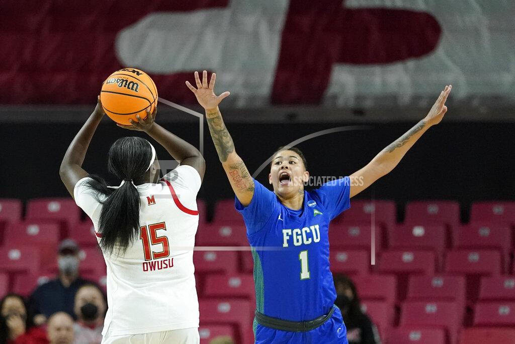 Julio Cortez Maryland guard Ashley Owusu (15) shoots against Florida Gulf Coast guard Kierstan Bell (1) during the first half of a college basketball game in the second round of the NCAA tournament, Sunday, March 20, 2022, in College Park, Md. (AP Photo/Julio Cortez)