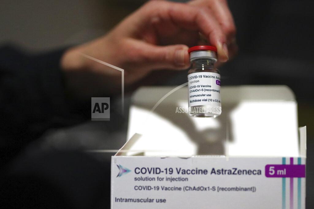Daniel Cole A medical staff dispays AstraZeneca COVID-19 vaccine at a vaccination site set up in the Marseille soccer Velodrome stadium, during a presentation to the media, in Marseille, Monday, March 15, 2021. The government plans to inoculate 10 million citizens by mid-April, 20 million by mid-May and a total of 30 million, or two-thirds of the adults by summer. (AP Photo/Daniel Cole)