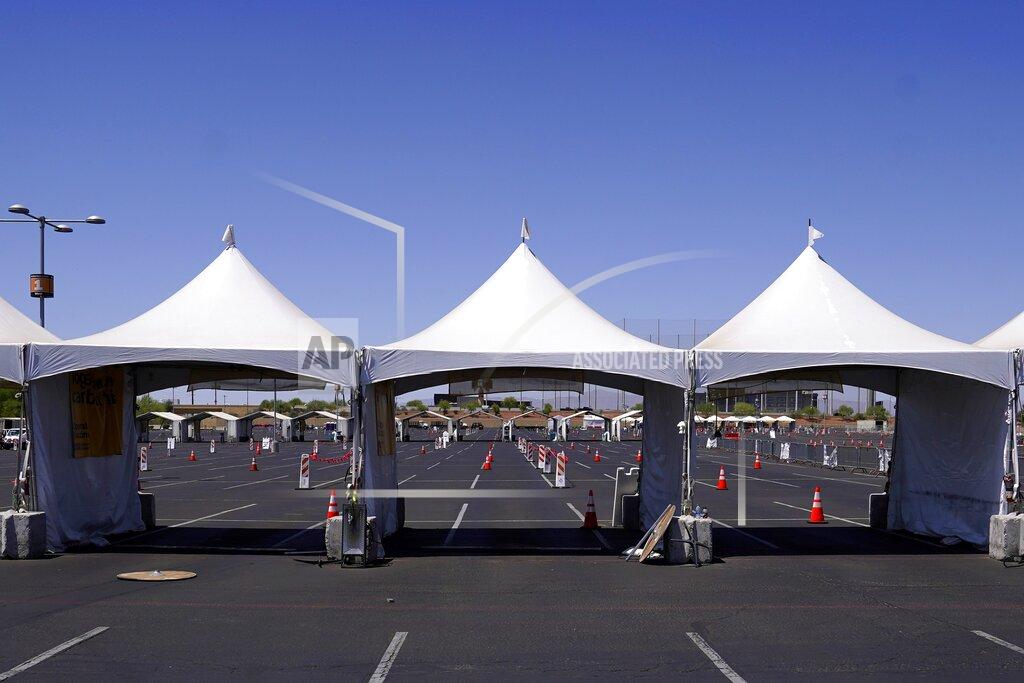 Ross D. Franklin The first Arizona state-run COVID-19 mass-vaccination site at State Farm Stadium closed Friday, April 23, 2021, in Glendale, Ariz. Arizona continues to transition outdoor operations to indoor venues. (AP Photo/Ross D. Franklin)