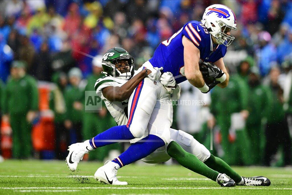 David Dermer New York Jets' Marcus Maye, left, tackles Buffalo Bills' Tommy Sweeney during the second half of an NFL football game Sunday, Dec. 29, 2019, in Orchard Park, N.Y. (AP Photo/David Dermer)