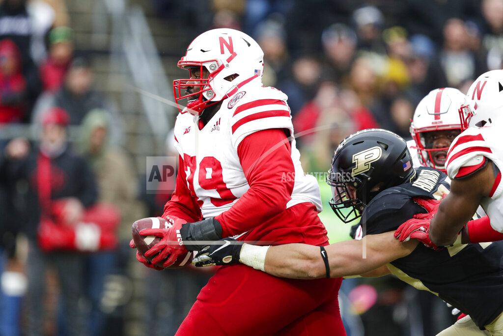 Michael Conroy Nebraska defensive lineman Darrion Daniels (79) is tackled by Purdue running back Zander Horvath (40) after an interception during the first half of an NCAA college football game in West Lafayette, Ind., Saturday, Nov. 2, 2019. (AP Photo/Michael Conroy)