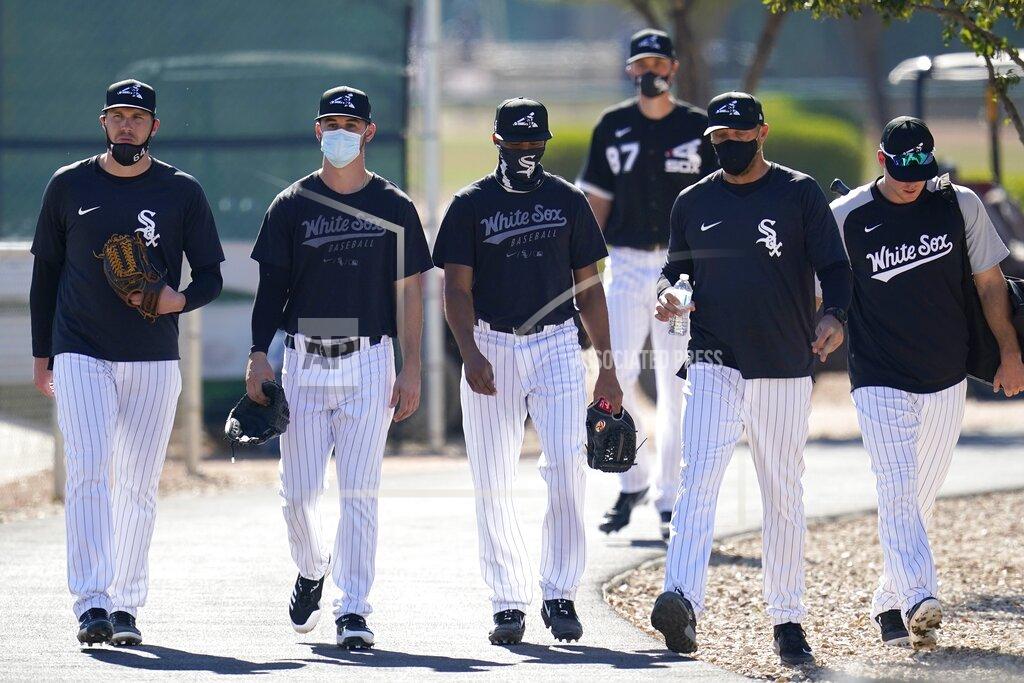 Ross D. Franklin Chicago White Sox players walk to another field during a spring training baseball practice Wednesday, Feb. 24, 2021, in Phoenix. (AP Photo/Ross D. Franklin)