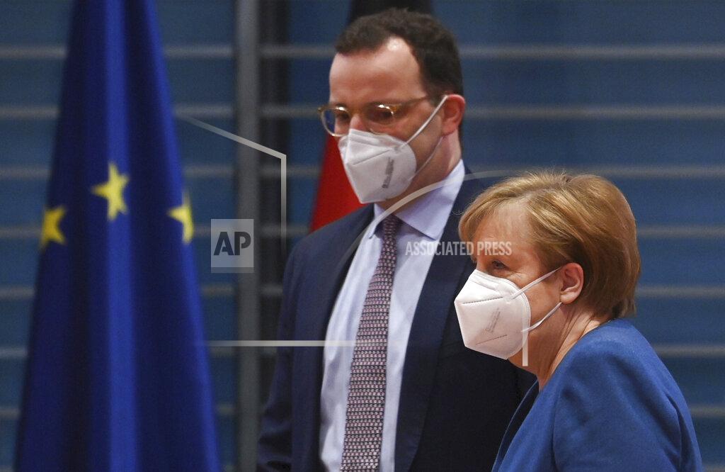 John Macdougall FILE - In this Jan. 6, 2021 file photo, German Chancellor Angela Merkel and Federal Health Minister Jens Spahn arrive at the weekly cabinet meeting wearing face masks in Berlin, Germany. The coronavirus pandemic is colliding with politics as Germany embarks on its vaccination drive and one of the most unpredictable election years in its post-World War II history. (John Macdougall/Pool via AP, File)