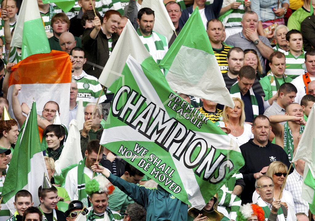 Scott Heppell FILE - This Sunday, March 25, 2012 file photo shows a general view of Celtic's supporter's during the Scottish Premier League soccer match between Rangers and Celtic at Ibrox, Glasgow, Scotland. Chaos is engulfing Scotland's attempts to deliver a resolution to the season and it might prove to a warning sign to other European leagues weighing up how to conclude a pandemic-affected campaign. The Scottish Professional Football League has on Tuesday, April 14, 2020 asked all 42 clubs in its league system to vote on whether to cancel the season and for final placings to be determined by the points per game of each club. (AP Photo/Scott Heppell, file)