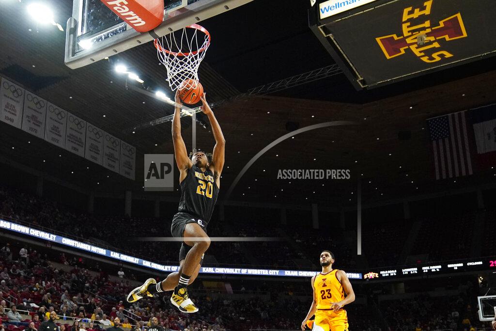 Charlie Neibergall Alabama State guard Kenny Strawbridge (20) drives to the basket ahead of Iowa State guard Tristan Enaruna (23) during the second half of an NCAA college basketball game, Tuesday, Nov. 16, 2021, in Ames, Iowa. (AP Photo/Charlie Neibergall)