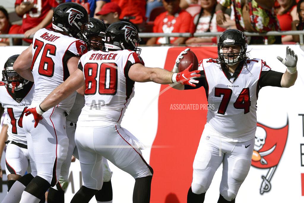 Jason Behnken Atlanta Falcons offensive tackle Ty Sambrailo (74) celebrates his 35-yard touchdown reception with tight end Luke Stocker (80) and offensive tackle Kaleb McGary (76) during the first half of an NFL football game against the Tampa Bay Buccaneers Sunday, Dec. 29, 2019, in Tampa, Fla. (AP Photo/Jason Behnken)
