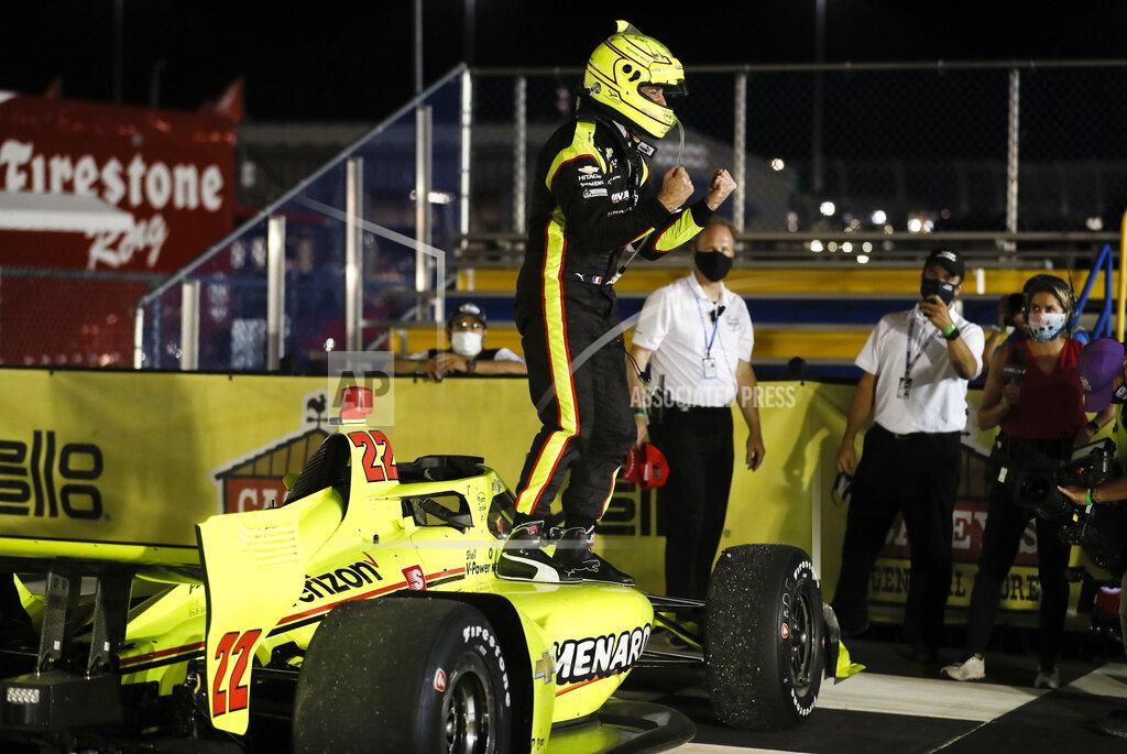 Charlie Neibergall Simon Pagenaud, of France, celebrates in Victory Lane after winning an IndyCar Series auto race Friday, July 17, 2020, at Iowa Speedway in Newton, Iowa. (AP Photo/Charlie Neibergall)
