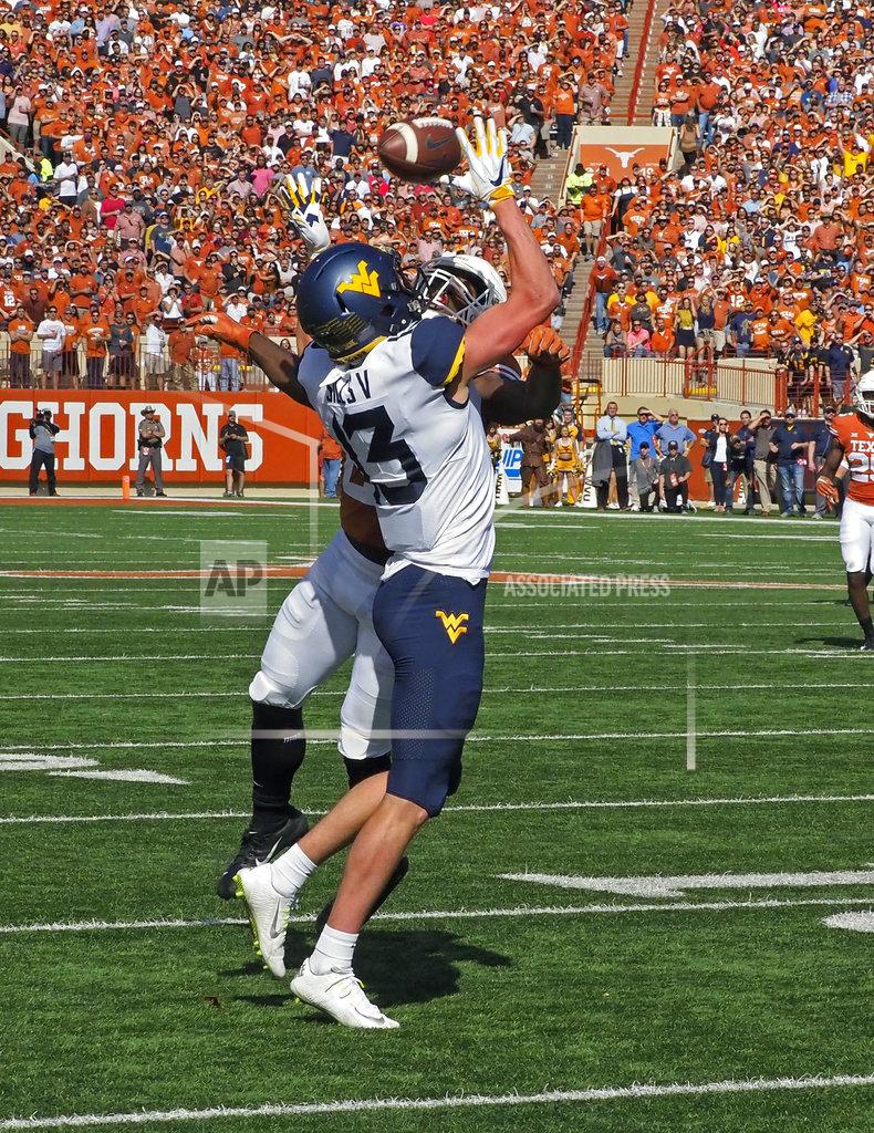 Michael Thomas West Virginia receiver David Sills, V (13) has a pass knocked away by Texas defensive back Kris Boyd during the first half of an NCAA college football game, Saturday, Nov. 3, 2018, in Austin, Texas. (AP Photo/Michael Thomas)