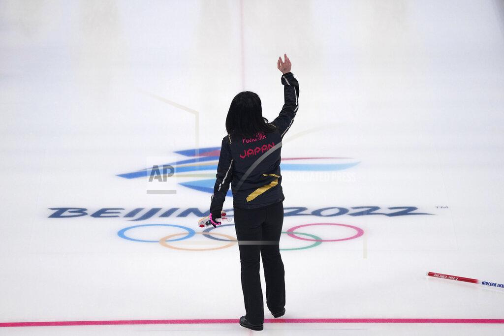 Nariman El-Mofty Japan's Satsuki Fujisawa waves to the crowd before leaving the ice at the end of the women's curling final match between Japan and Britain at the Beijing Winter Olympics Sunday, Feb. 20, 2022, in Beijing. (AP Photo/Nariman El-Mofty)