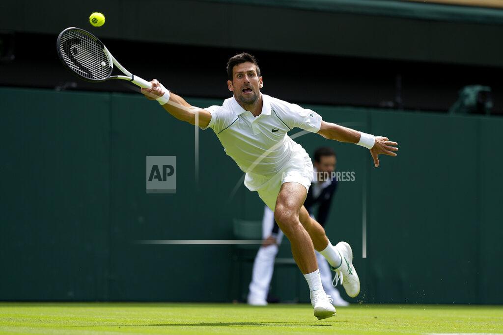 Alastair Grant Serbia's Novak Djokovic returns the ball to Australia's Thanasi Kokkinakis during their singles tennis match on day three of the Wimbledon tennis championships in London, Wednesday, June 29, 2022. (AP Photo/Alastair Grant)