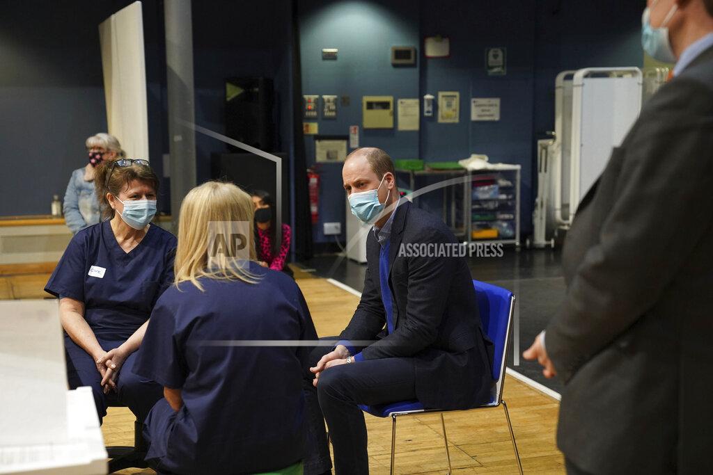 Arthur Edwards Britain's Prince William, center, speaks to staff and volunteers during his visit to the King's Lynn Corn Exchange Vaccination Centre in King's Lynn, Monday Feb. 22, 2021. (Arthur Edwards/Pool via AP)