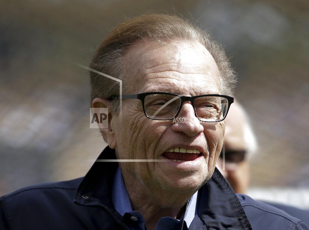 Jae C. Hong FILE - This April 1, 2013 file photo shows talk show host Larry King attends a season-opening baseball game between the Los Angeles Dodgers and the San Francisco Giants in Los Angeles. King, who interviewed presidents, movie stars and ordinary Joes during a half-century in broadcasting, has died at age 87. Ora Media, the studio and network he co-founded, tweeted that King died Saturday, Jan. 23, 2021 morning at Cedars-Sinai Medical Center in Los Angeles. (AP Photo/Jae C. Hong, File)