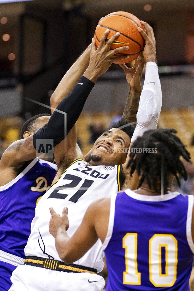 L.g. Patterson Missouri's Ronnie DeGray III, center, pulls down a rebound between Paul Quinn's Steven Tynes, right, and Quintin Hudson, left, during the second half of an NCAA college basketball game Monday, Nov. 29, 2021, in Columbia, Mo. Missouri won 91-59. (AP Photo/L.G. Patterson)
