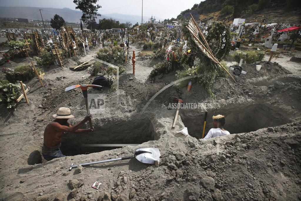 Marco Ugarte FILE - In this March 31, 2021 file photo, men dig graves at the Valle de Chalco cemetery during the new coronavirus pandemic on the outskirts of Mexico City. Mexico’s unwillingness to spend money, do more testing, change course or react to new scientific evidence contributed to the country being one of the worst-hit by the coronavirus pandemic, according to a report released the third week of April, by the University of California, San Francisco. (AP Photo/Marco Ugarte, File)