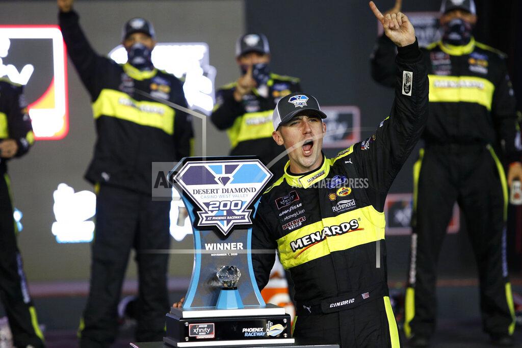 Ralph Freso Austin Cindric celebrates in Victory Lane with the race trophy after winning a NASCAR Xfinity Series auto race at Phoenix Raceway, Saturday, Nov. 7, 2020, in Avondale, Ariz. (AP Photo/Ralph Freso)