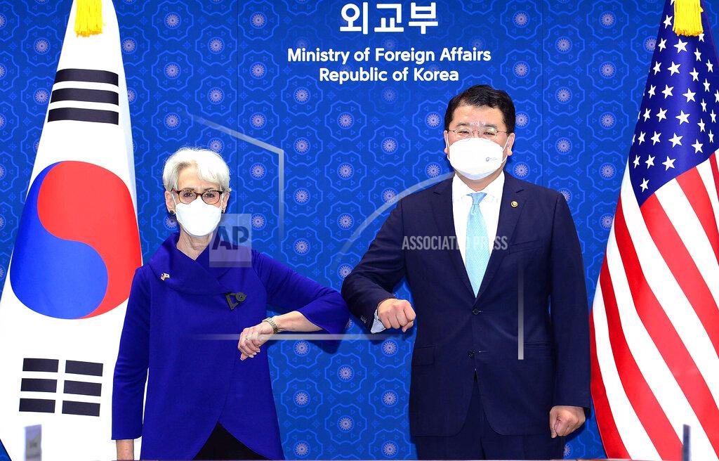 Uncredited In this photo provided by South Korea Foreign Ministry, U.S. Deputy Secretary of State Wendy Sherman, left, bumps elbows with South Korean First Vice Foreign Minister Choi Jong Kun prior to their meeting at the Foreign Ministry in Seoul, South Korea, Friday, July 23, 2021. Top U.S. and South Korean officials agreed Thursday to try to convince North Korea to return to talks on its nuclear program, which Pyongyang has insisted it won't do in protest of what it calls U.S. hostility. (South Korea Foreign Ministry via AP)