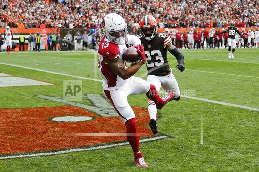 Arizona Cardinals wide receiver Christian Kirk (13) catches a 21-yard touchdown pass against Cleveland Browns cornerback Troy Hill (23) during the first half of an NFL football game, Sunday, Oct. 17, 2021, in Cleveland. (AP Photo/Ron Schwane)
