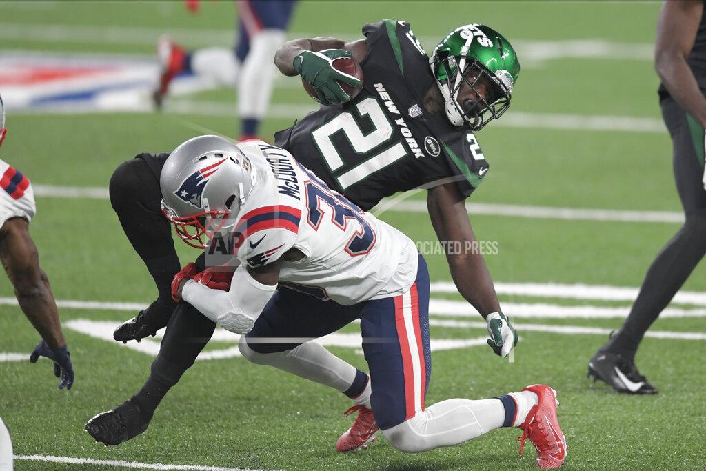 Bill Kostroun New York Jets' Frank Gore, top, is tackled by New England Patriots' Jason McCourty during the second half of an NFL football game, Monday, Nov. 9, 2020, in East Rutherford, N.J. (AP Photo/Bill Kostroun)
