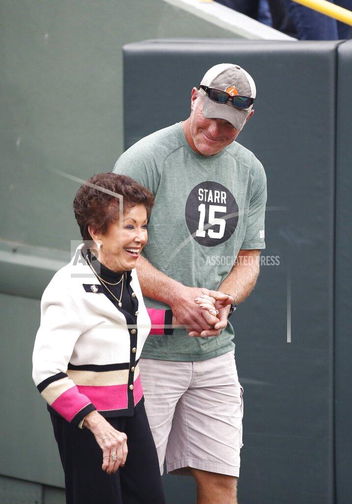 Matt Ludtke Former Green Bay Packers quarterback Brett Favre escorts Sherry Starr out of the tunnel before an NFL football game between the Green Bay Packers and the Minnesota Vikings Sunday, Sept. 15, 2019, in Green Bay, Wis. (AP Photo/Matt Ludtke)