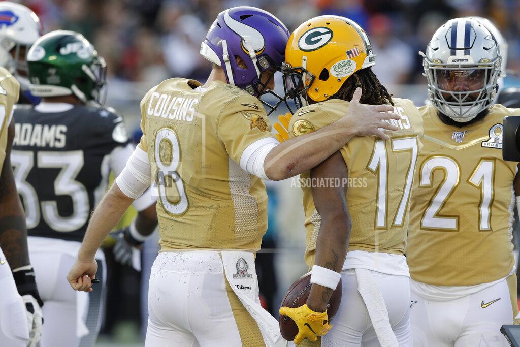 Chris O?Meara NFC quarterback Kirk Cousins, of the Minnesota Vikings, congratulates NFC wide receiver Davante Adams, of the Green Bay Packers, after Adams scored a touchdown, during the second half of the NFL Pro Bowl football game against the AFC, Sunday, Jan. 26, 2020, in Orlando, Fla. (AP Photo/Chris O?Meara)