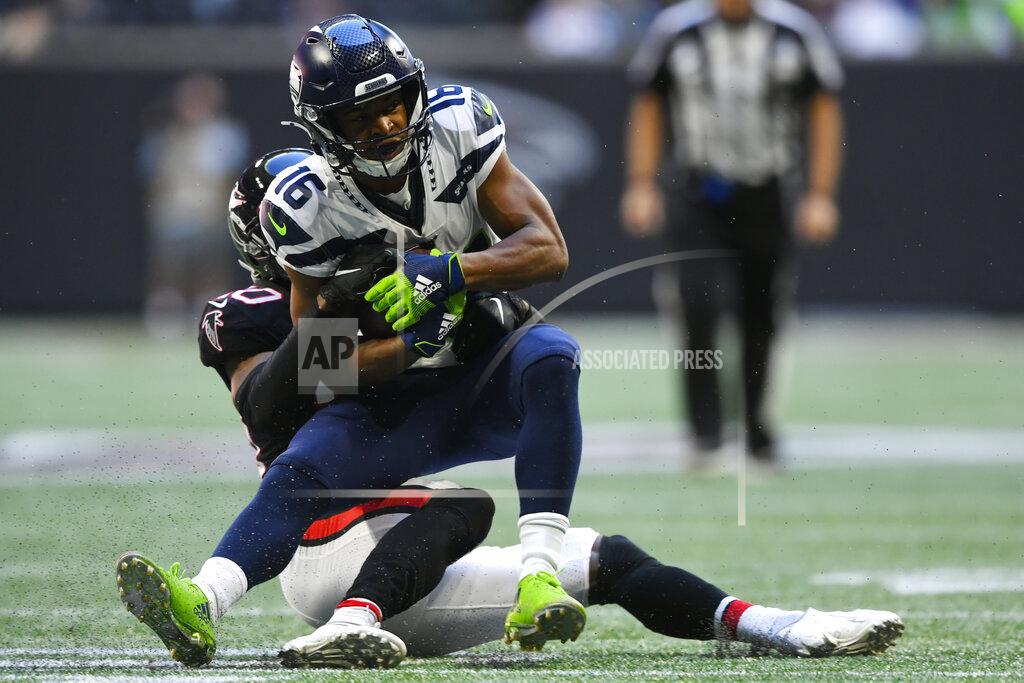 John Amis Atlanta Falcons defensive back Kendall Sheffield (20) hits Seattle Seahawks wide receiver Tyler Lockett (16) during the first half of an NFL football game, Sunday, Oct. 27, 2019, in Atlanta. (AP Photo/John Amis)