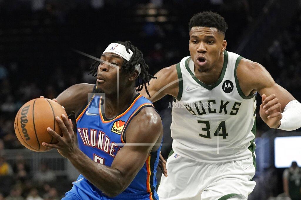 Morry Gash Oklahoma City Thunder's Luguentz Dort looks to pass in front of Milwaukee Bucks' Giannis Antetokounmpo during the first half of an NBA preseason basketball game Sunday, Oct. 10, 2021, in Milwaukee. (AP Photo/Morry Gash)
