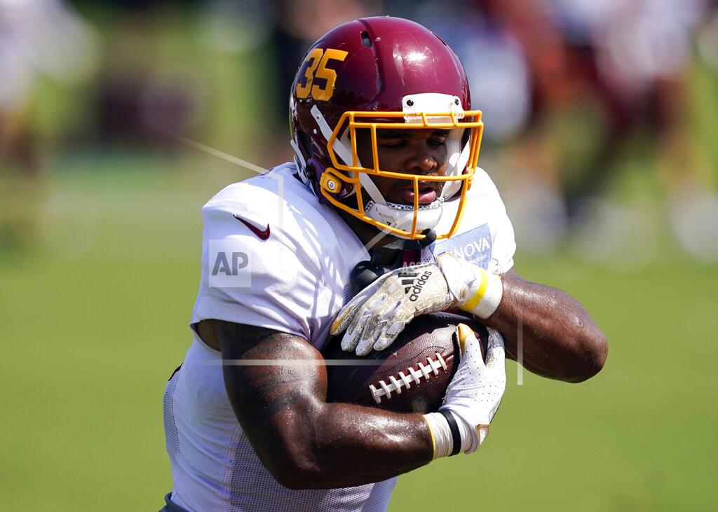 Alex Brandon FILE - In this Aug. 24, 2021, file photo, Washington Football Team running back Jaret Patterson runs a drill during practice at the team's NFL football training facility in Ashburn, Va. Patterson made the team thanks to an impressive training camp and preseason. Now the 5-foot-8 dynamo is getting praise from Barry Sanders and those who know him best expect Patterson to take the league by storm. (AP Photo/Alex Brandon, File)