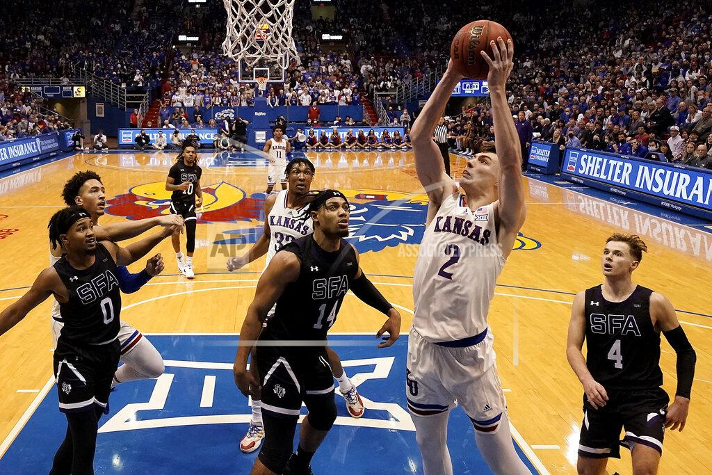 Charlie Riedel Kansas' Christian Braun (2) shoots during the second half of an NCAA college basketball game against Stephen F. Austin Saturday, Dec. 18, 2021, in Lawrence, Kan. (AP Photo/Charlie Riedel)