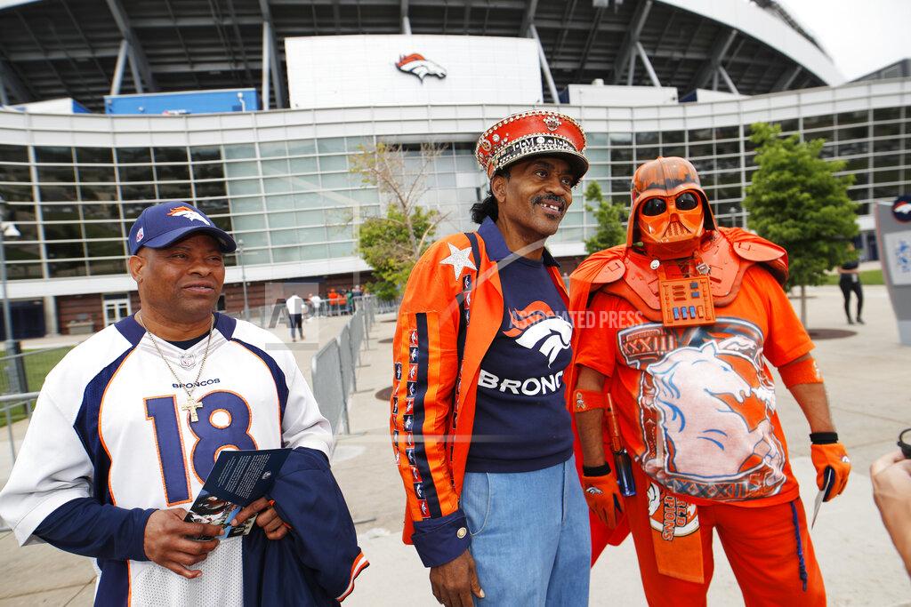 David Zalubowski From left, Denver Broncos fans Clinton Mayfield, Ralph Williams and James Chavez head out of a five-hour memorial for team owner Pat Bowlen Tuesday, June 18, 2019 at Mile High Stadium, the NFL football team's home in Denver. Bowlen, who has owned the franchise for more than three decades, died last Thursday. (AP Photo/David Zalubowski)