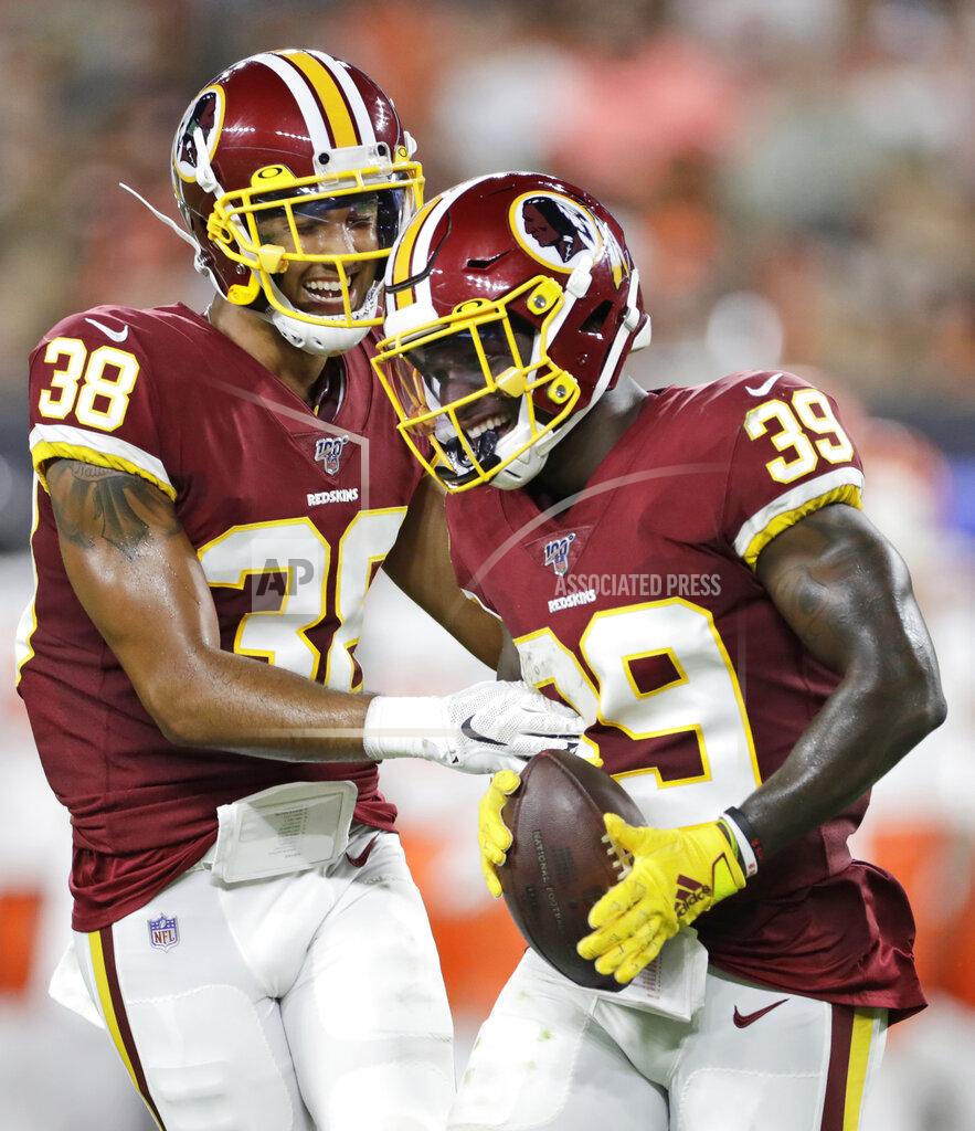 Ron Schwane Washington Redskins defensive back Jeremy Reaves (39) celebrates with defensive back Deion Harris (38) after recovering a Cleveland Browns fumble during the second half of an NFL preseason football game Thursday, Aug. 8, 2019, in Cleveland. (AP Photo/Ron Schwane)
