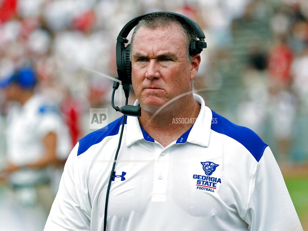 FILE - In this Sept. 8, 2018, file photo, Georgia State head coach Shawn Elliott walks the sidelines during the first half of an NCAA college football game against North Carolina State in Raleigh, N.C. The NCAA’s new transfer rules, including the creation of the so-called portal, have changed the process by which athletes switch schools, loosening some restrictions and leading more players to explore options. Elliott said if the Panthers bring in a transfer he prefers it to be a player with which the staff is already familiar. (AP Photo/Chris Seward, File)