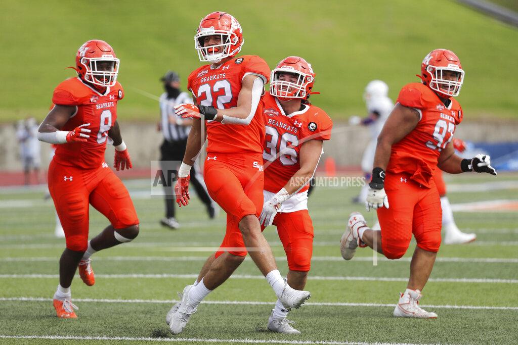 Brett Coomer Sam Houston State defensive back Zyon McCollum (22) celebrates after intercepting a pass during the fourth quarterof a semifinal game in the NCAA college football FCS playoffs against James Madison, Saturday, May 8, 2021, in Huntsville, Texas. Sam Houston came from behind to edge James Madison 38-35, for a berth in the FCS national championship game. (Brett Coomer/Houston Chronicle via AP)