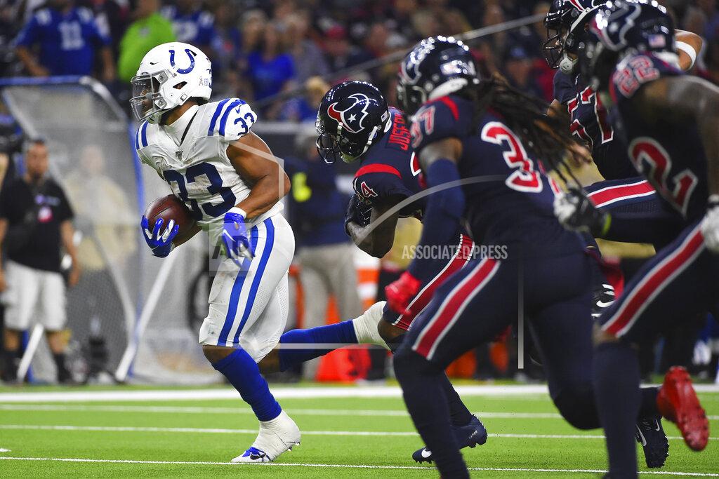 Eric Christian Smith Indianapolis Colts running back Jonathan Williams (33) runs past Houston Texans defenders for a touchdown during the second half of an NFL football game Thursday, Nov. 21, 2019, in Houston. (AP Photo/Eric Christian Smith)