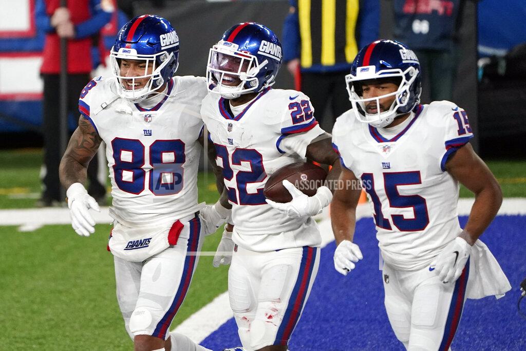 Corey Sipkin New York Giants' Wayne Gallman, center, celebrates his touchdown with Evan Engram, left, and Golden Tate during the first half of an NFL football game against the Tampa Bay Buccaneers, Monday, Nov. 2, 2020, in East Rutherford, N.J. (AP Photo/Corey Sipkin)