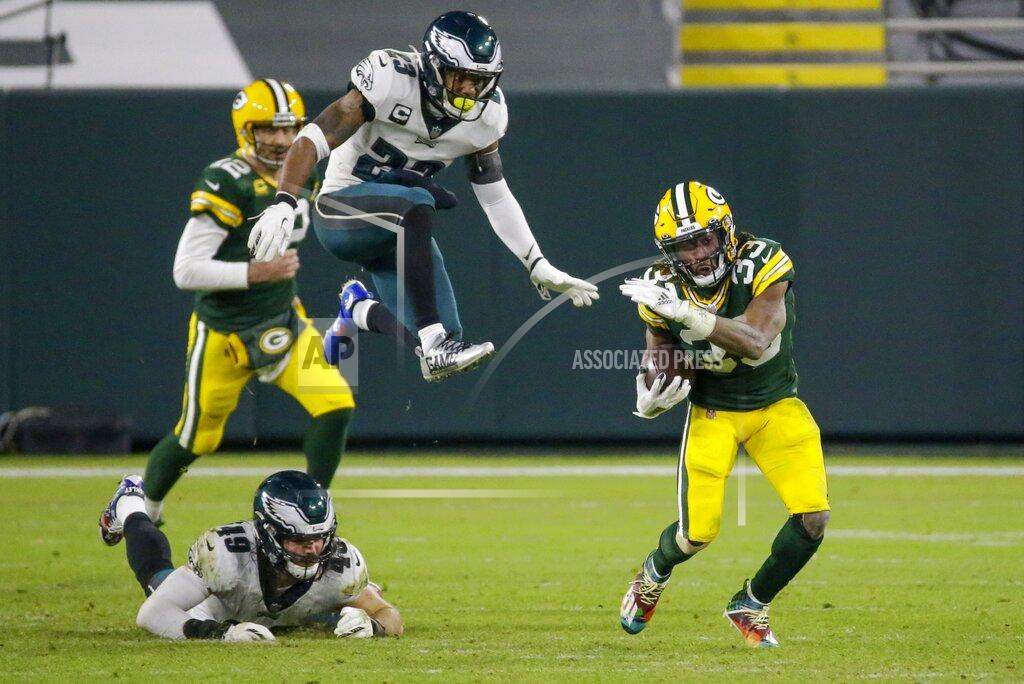 Mike Roemer Green Bay Packers' Aaron Jones runs for a 77-yard touchdown during the second half of an NFL football game against the Philadelphia Eagles Sunday, Dec. 6, 2020, in Green Bay, Wis. (AP Photo/Mike Roemer)