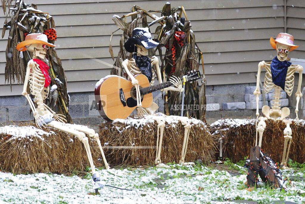 Mark Moran A Halloween lawn display in Kingston Township, Pa., is covered with snow after a late October storm passed over the Northeast, Friday, Oct. 30, 2020. (Mark Moran/The Citizens' Voice via AP)