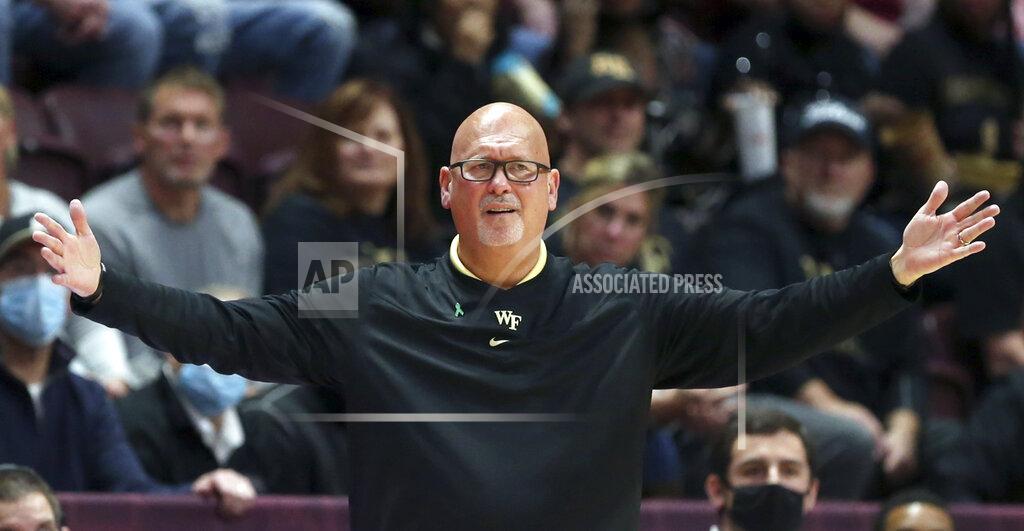 Matt Gentry Wake Forest head basketball coach Steve Forbes raising his arms in the first half of an NCAA college basketball game in Blacksburg, Va. Saturday, Dec. 4 2021. (Matt Gentry/The Roanoke Times via AP)