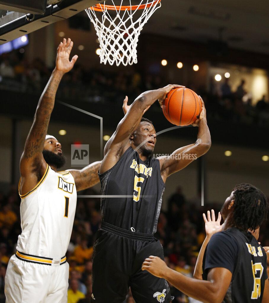 James H. Wallace Alabama State's Tobi Ewueshe (5) pulls in a rebound against Virginia Commonwealth's Mike'L Simms during an NCAA college basketball game in Richmond, Va., Monday, Nov. 25, 2019. (James H. Wallace/Richmond Times-Dispatch via AP)