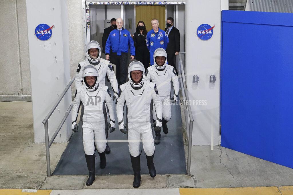 Uncredited The Crew Dragon space capsule astronauts, from front left; NASA astronaut Megan McArthur, NASA astronaut Shane Kimbrough and back row European Space Agency astronaut Thomas Pesquet and Japan Aerospace Exploration Agency astronaut Akihiko Hoshide leave the Operation and Checkout Building on their way to board the capsule for a mission to the International Space Station at the Kennedy Space Center in Cape Canaveral, Fla., Friday, April 23, 2021. (AP Photo/John Raoux)