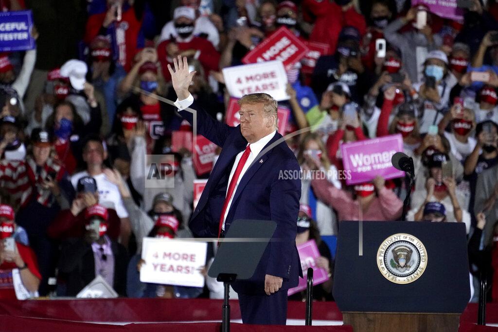 John Bazemore President Donald Trump waves as he leaves after speaking at a campaign rally at Middle Georgia Regional Airport, Friday, Oct. 16, 2020, in Macon, Ga. (AP Photo/John Bazemore)