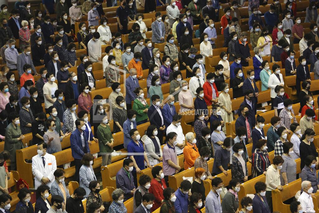 Ahn Young-Joon Christians wearing face masks to help protect against the spread of the new coronavirus pray during a service at the Yoido Full Gospel Church in Seoul, South Korea, Sunday, May 31, 2020. (AP Photo/Ahn Young-joon)