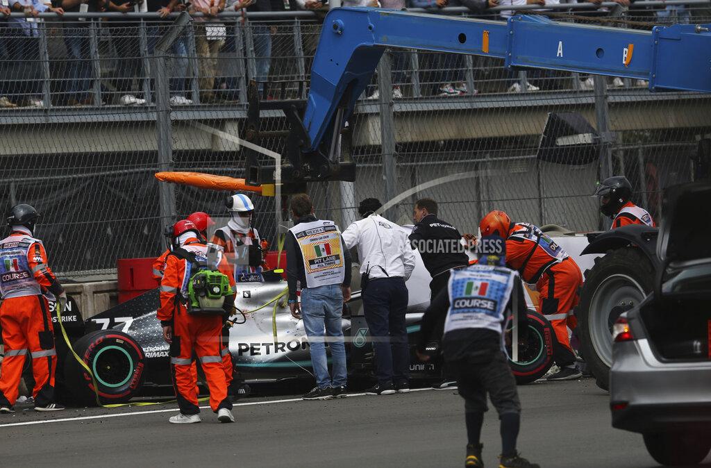 Marco Ugarte Mercedes driver Valtteri Bottas' car is lifted with a crane after he crashed in a curve during the qualifying session for the Formula One Mexico Grand Prix auto race at the Hermanos Rodriguez racetrack in Mexico City, Saturday, Oct. 26, 2019. (AP Photo/Marco Ugarte)
