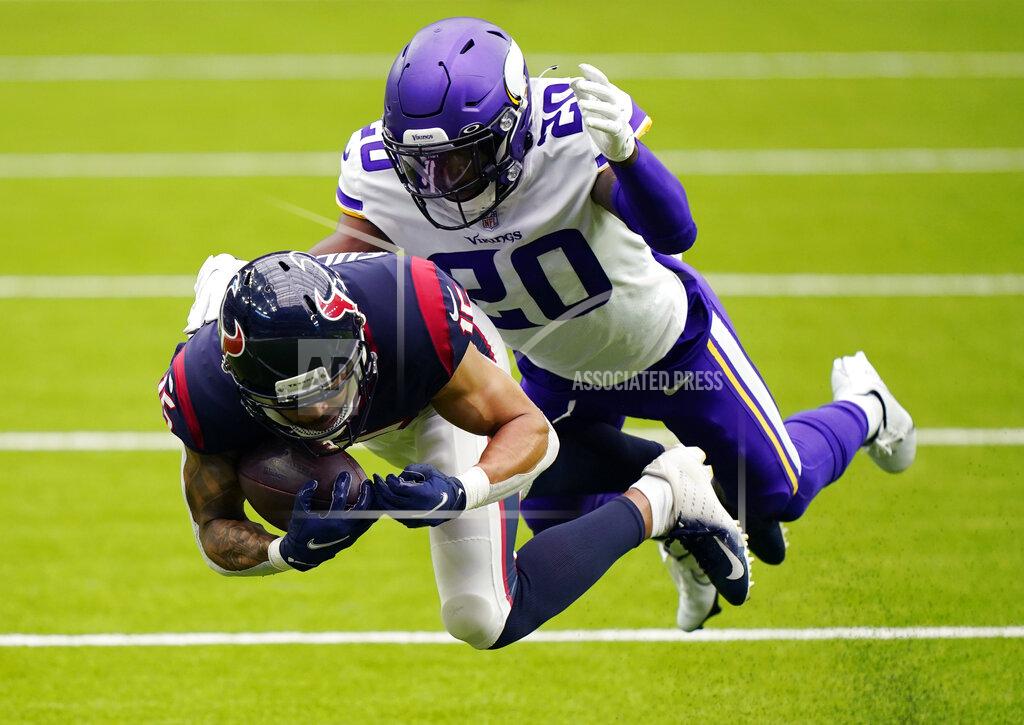 David J. Phillip Houston Texans wide receiver Will Fuller (15) makes a catch for a first down in front of Minnesota Vikings cornerback Jeff Gladney (20) during the second half of an NFL football game Sunday, Oct. 4, 2020, in Houston. (AP Photo/David J. Phillip)