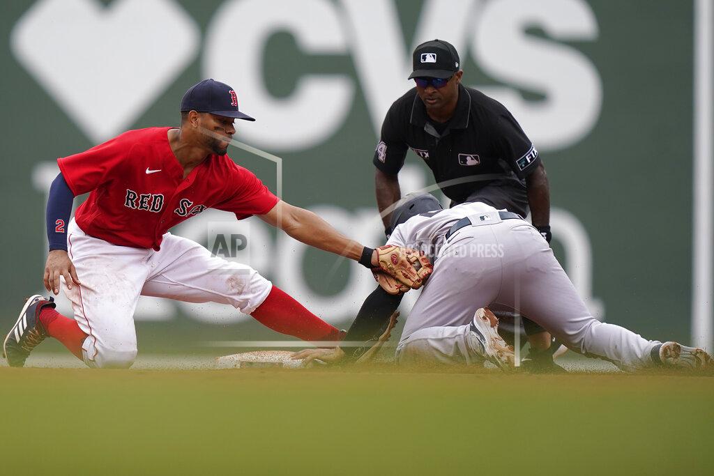 Steven Senne New York Yankees' Gleyber Torres, front right, steals second base as Boston Red Sox's Xander Bogaerts, left, tries to tag him in the eighth inning of a baseball game, Sunday, July 25, 2021, in Boston. (AP Photo/Steven Senne)