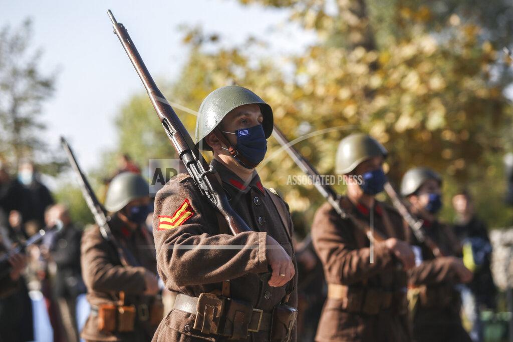 Giannis Papanikos Greek soldiers wearing WWII Military costumes take part in the military parade at the northern port city of Thessaloniki, Greece, Thursday, Oct. 28, 2021 .The parade is held to celebrate Greece's refusal to align itself with a belligerent fascist Italy in 1940 and instead fight a much stronger opponent, a decision which dragged it into World War II and eventually led to a brutal occupation by Nazi Germany. (AP Photo/Giannis Papanikos)