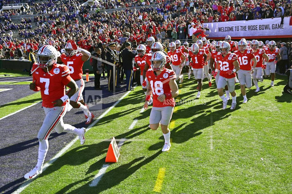 Mark J. Terrill Ohio State runs onto the field for warm ups before the Rose Bowl NCAA college football game against Washington Tuesday, Jan. 1, 2019, in Pasadena, Calif. (AP Photo/Mark J. Terrill)