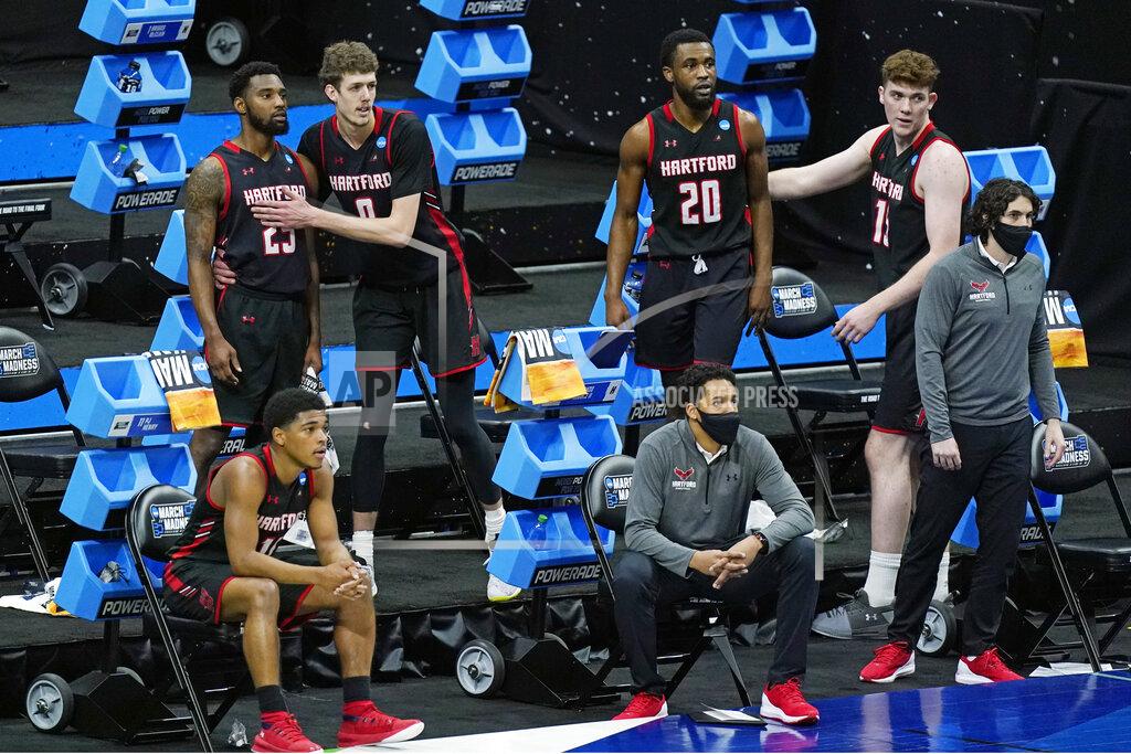 Mark Humphrey Hartford players watch the final moments of their loss to Baylor during a college basketball game in the first round of the NCAA tournament at Lucas Oil Stadium in Indianapolis Friday, March 19, 2021, in Indianapolis, Tenn. (AP Photo/Mark Humphrey)
